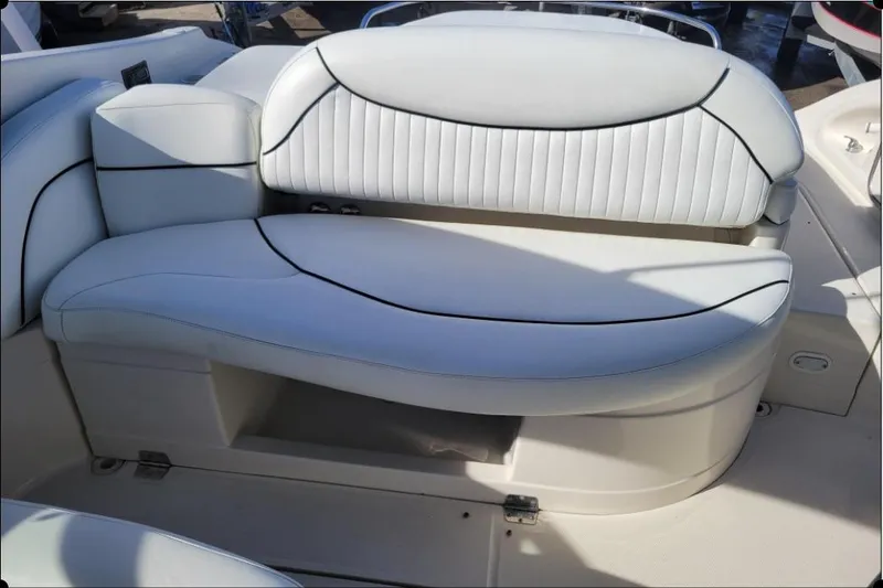 Slide: The Image of 2004 Monterey 298SS Super Sport boat interior with white cushioned seating. - 16