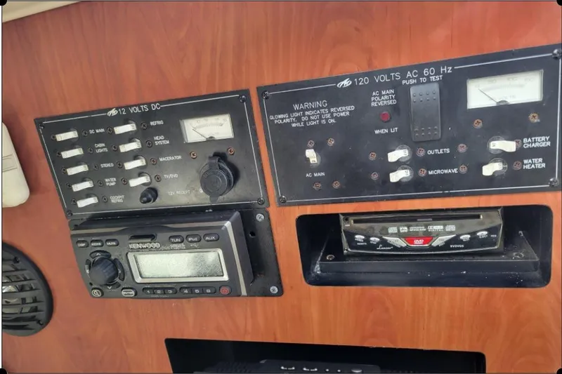 Slide: The Image of Control panel of a 2004 Monterey 298SS Super Sport boat with switches and gauges. - 24