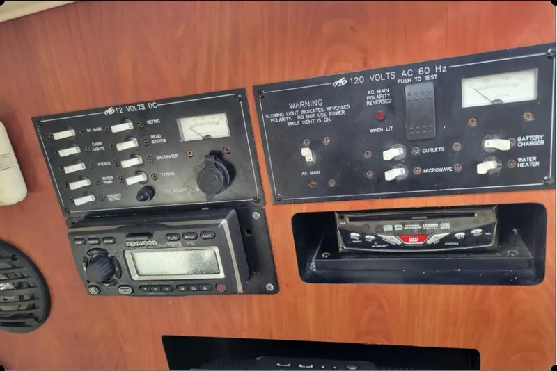 Slide: The Image of Control panel of a 2004 Monterey 298SS Super Sport boat with switches and gauges. - 25