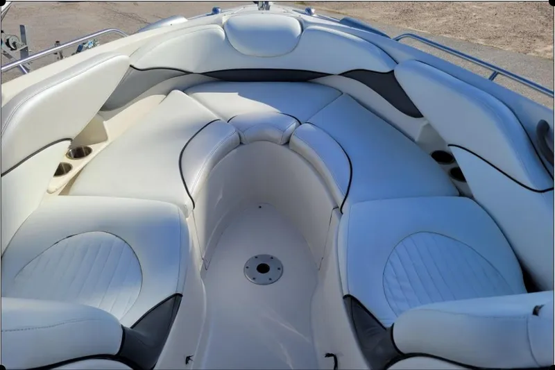 Slide: The Image of 2004 Monterey 298SS Super Sport boat interior with white cushioned seating. - 28