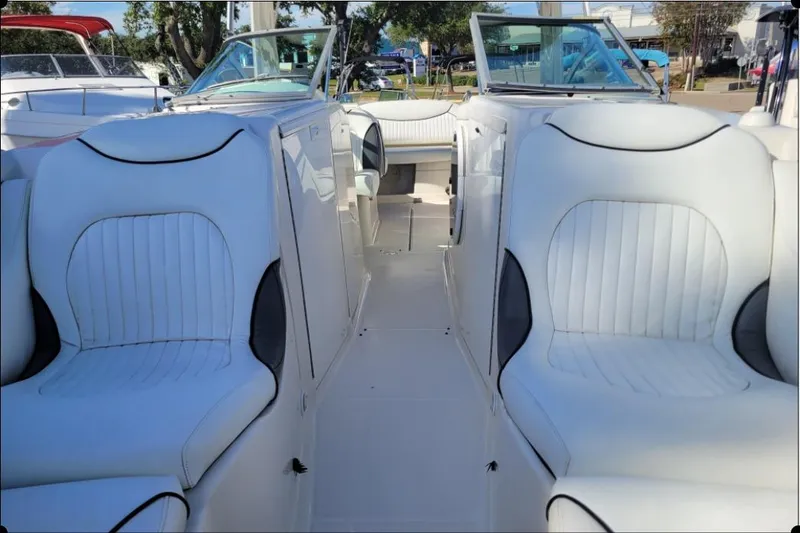 Slide: The Image of Interior view of a 2004 Monterey 298SS Super Sport boat with white seating. - 29