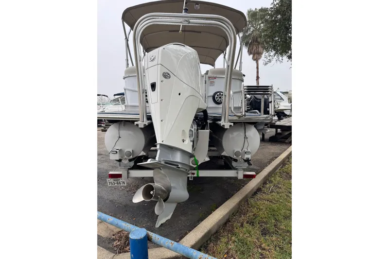 Slide: The Image of Rear view of a 2004 Monterey 298SS Super Sport boat with dual outboard motors. - 5