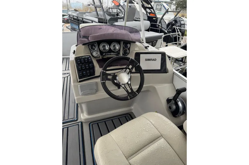 Slide: The Image of 2004 Monterey 298SS Super Sport boat dashboard with steering wheel and controls. - 9