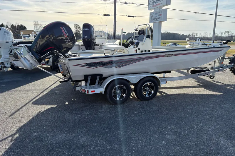 The Image of 2026 Ranger RB200 boat on trailer, featuring sleek design and powerful outboard motor. - 1