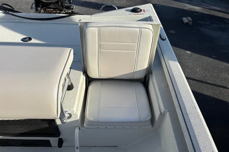 Slide: The Image of 2026 Ranger RB200 boat seat with white upholstery in sunlight. - 10