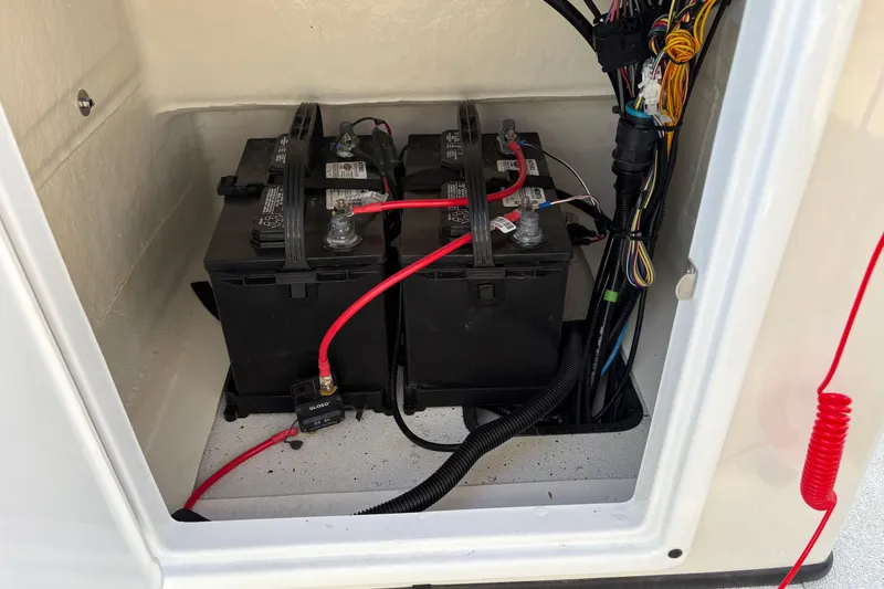 Slide: The Image of Battery compartment of 2026 Ranger RB200 with wiring and connections. - 11