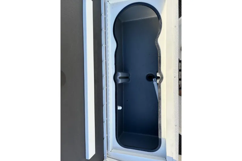 Slide: The Image of Ranger RB200 2026 boat storage compartment with sleek design and secure latch. - 14