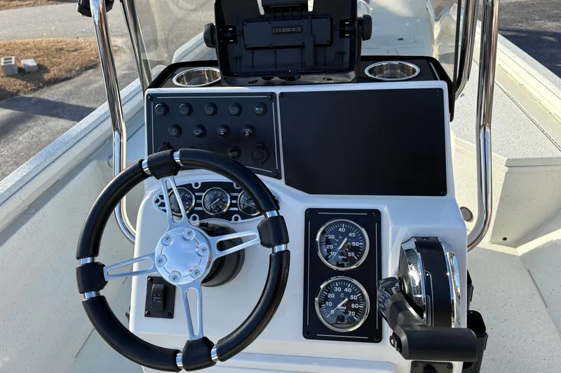 Slide: The Image of 2026 Ranger RB200 boat dashboard with steering wheel, gauges, and controls. - 16