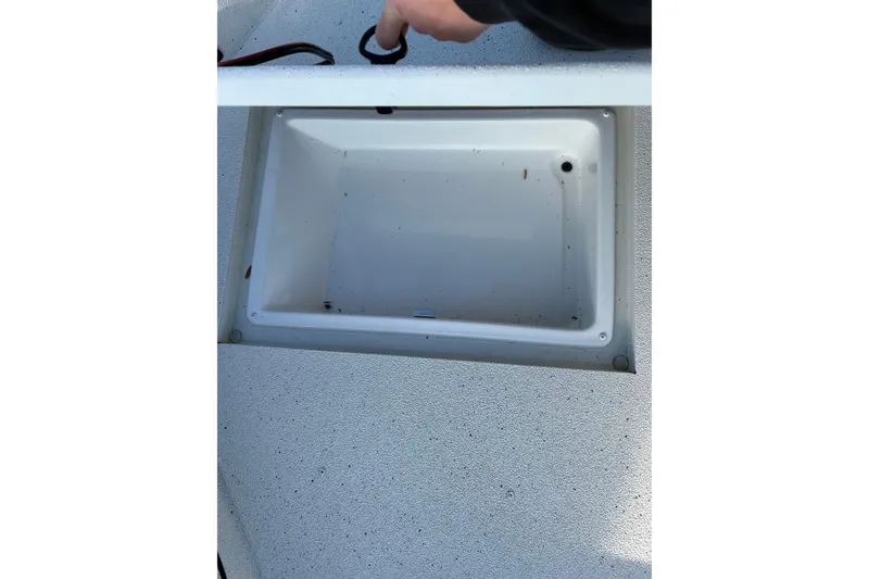 Slide: The Image of Open storage compartment in 2026 Ranger RB200 boat, showing interior details. - 17