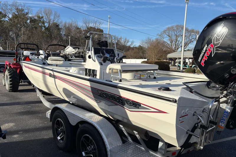 Slide: The Image of 2026 Ranger RB200 boat on trailer with Mercury Pro XS engine, parked outdoors. - 3