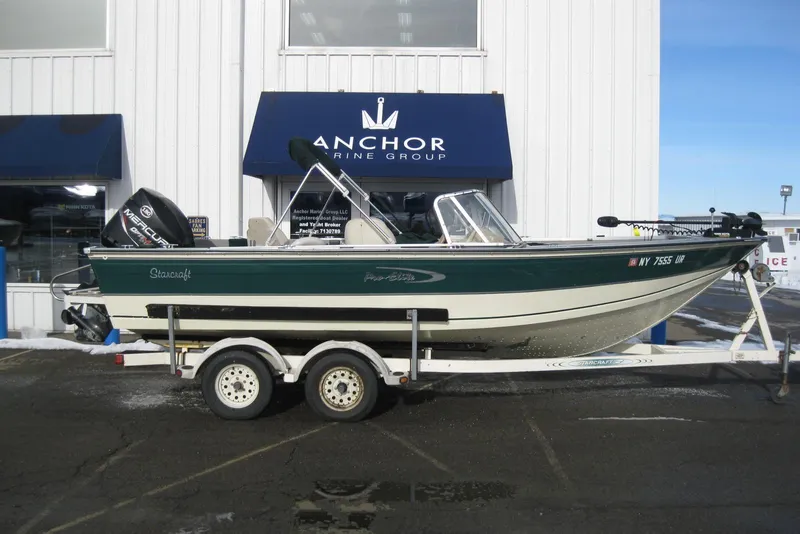 The Image of 1999 Starcraft Pro-Elite 2000 boat on trailer at Anchor Marine Group. - 1