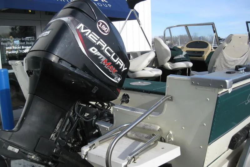 Slide: The Image of 1999 Starcraft Pro-Elite 2000 boat with Mercury OptiMax 180 outboard motor. - 5