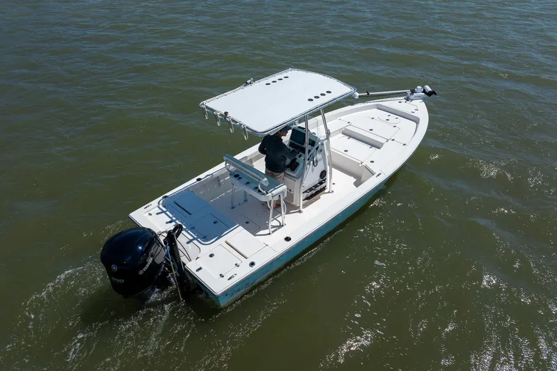 Slide: The Image of 2018 Pathfinder 2400 TRS boat navigating on open water, featuring a sleek design and outboard motor. - 11