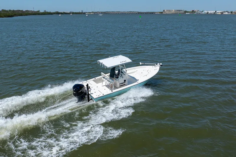 Slide: The Image of 2018 Pathfinder 2400 TRS boat cruising on open water. - 15