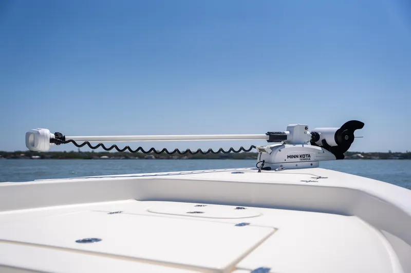 Slide: The Image of 2018 Pathfinder 2400 TRS boat with Minn Kota Terrova trolling motor on calm water. - 19