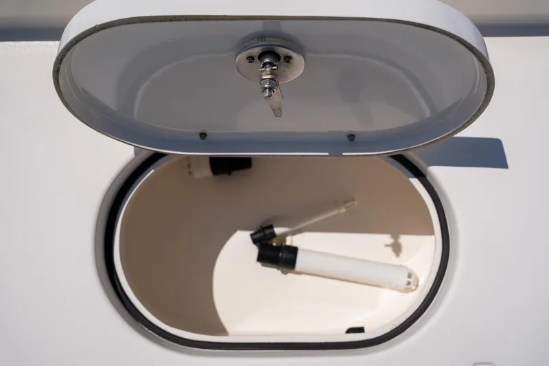 Slide: The Image of Open storage compartment on 2018 Pathfinder 2400 TRS boat, showing interior details. - 22