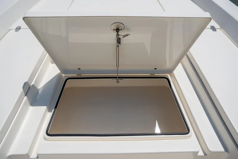 Slide: The Image of Open storage compartment on 2018 Pathfinder 2400 TRS boat. - 27