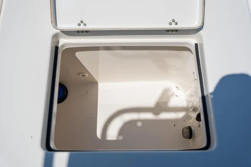 Slide: The Image of Open storage compartment on a 2018 Pathfinder 2400 TRS boat. - 51