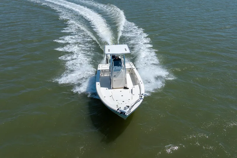 Slide: The Image of 2018 Pathfinder 2400 TRS boat cruising on open water, aerial view. - 6