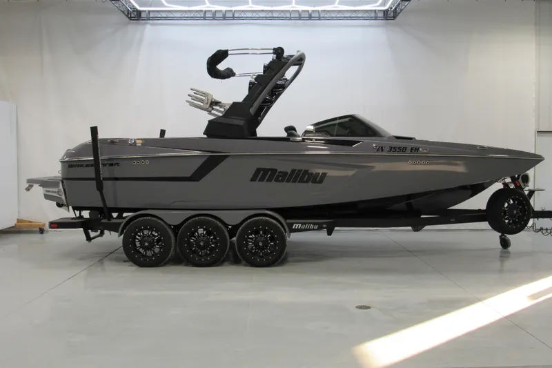 The Image of 2021 Malibu Wakesetter 24 MXZ boat on trailer in showroom. - 0