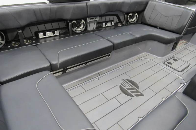 Slide: The Image of 2021 Malibu Wakesetter 24 MXZ interior with sleek seating and modern design. - 8