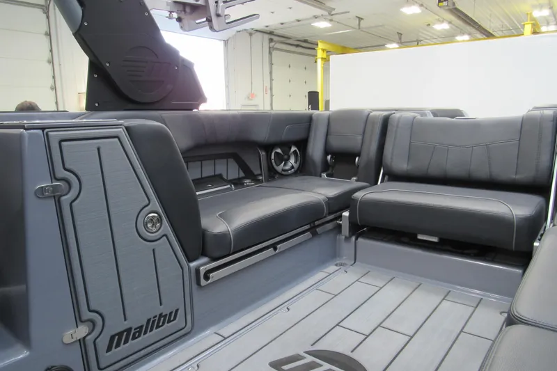 Slide: The Image of 2021 Malibu Wakesetter 24 MXZ interior with sleek seating and modern design. - 9