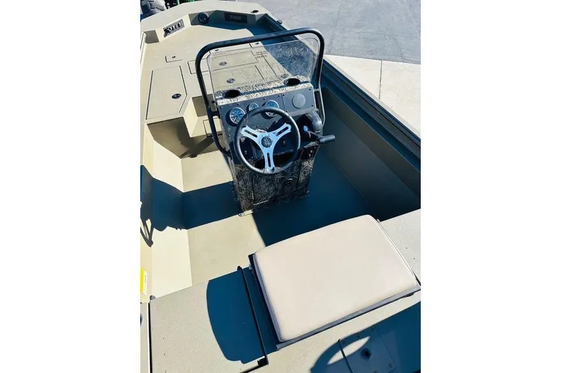 Slide: The Image of 2026 Thor 1900 boat interior with steering wheel and seating. - 2