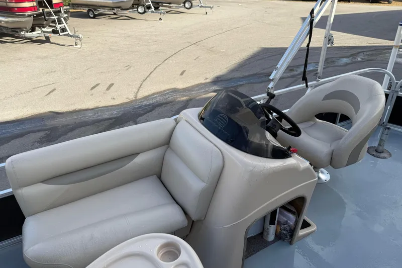 Slide: The Image of 2015 Sun Tracker Fishin' Barge 20 DLX interior with steering console and seating. - 13