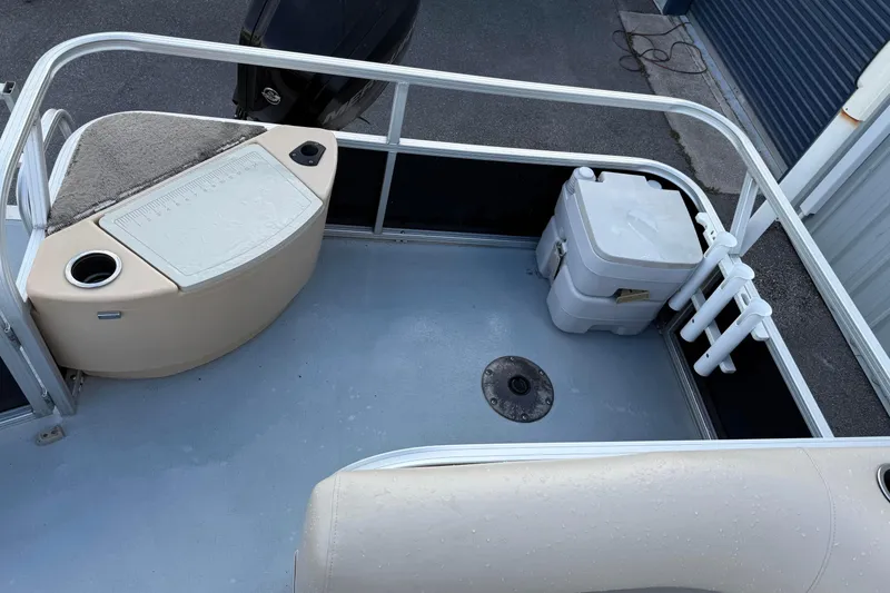 Slide: The Image of 2015 Sun Tracker Fishin' Barge 20 DLX deck with storage and seating area. - 8