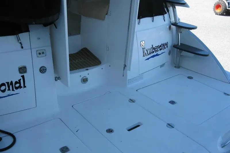 Slide: The Image of 2008 Doral Alegria boat deck with metal fittings and clean white surface. - 12