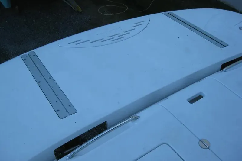 Slide: The Image of 2008 Doral Alegria boat interior with beige seating and white cabinetry. - 14