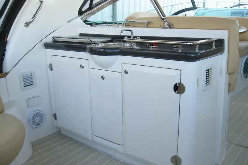 Slide: The Image of Open refrigerator inside a 2008 Doral Alegria boat, showing empty shelves and a temperature dial. - 19