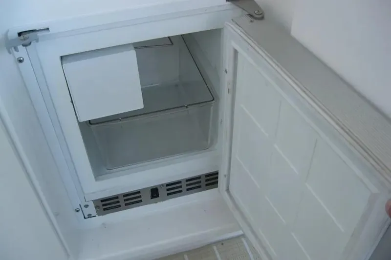 Slide: The Image of 2008 Doral Alegria boat interior with beige curved seating and modern design. - 22