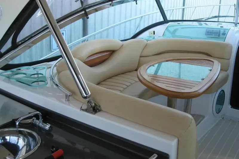 Slide: The Image of Wooden table with nautical-themed glass inlay on 2008 Doral Alegria boat interior. - 26