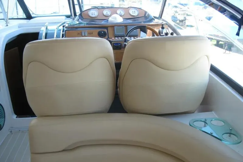 Slide: The Image of Steering wheel and controls of a 2008 Doral Alegria boat dashboard. - 30