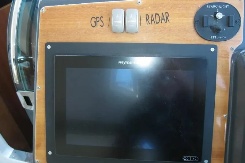 Slide: The Image of Dashboard gauges of a 2008 Doral Alegria boat, featuring RPM and pressure indicators. - 38