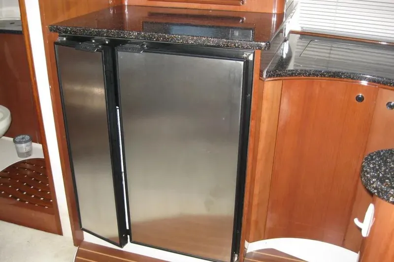 Slide: The Image of Built-in microwave in 2008 Doral Alegria yacht kitchen with wooden cabinetry. - 47