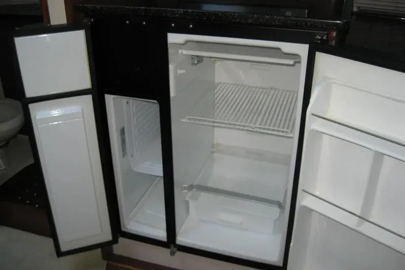 Slide: The Image of Pull-out cutting board under microwave in a 2008 Doral Alegria kitchen. - 48