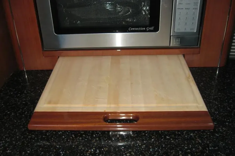 Slide: The Image of 2008 Doral Alegria yacht kitchen with granite countertop, coffee maker, and porthole window. - 50