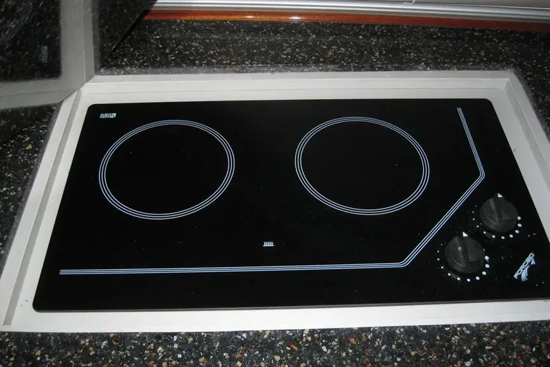 Slide: The Image of Wooden cabinet with open door revealing three white drawers, Doral Alegria 2008 model. - 53