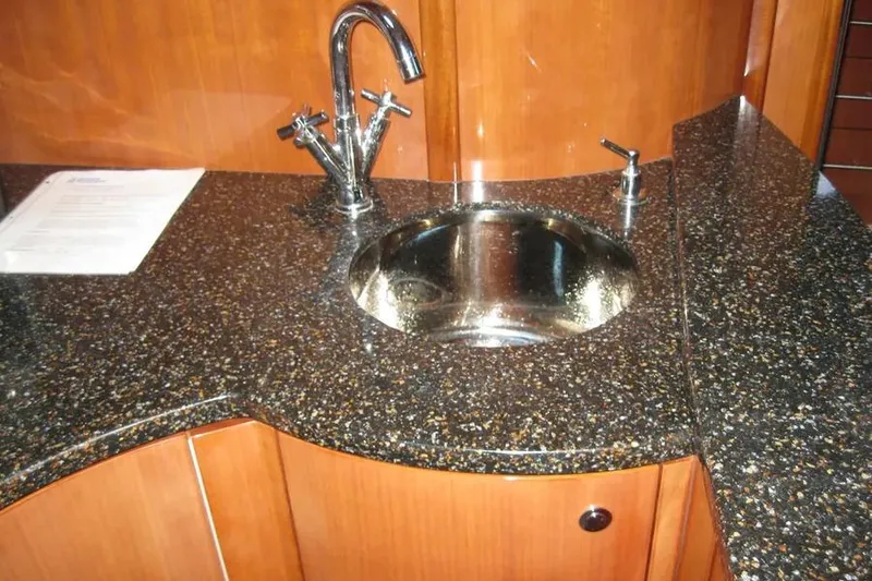 Slide: The Image of Interior of 2008 Doral Alegria yacht with beige seating, wooden table, and TV. - 54