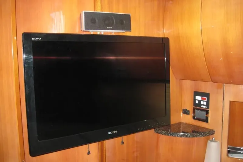 Slide: The Image of Interior of 2008 Doral Alegria yacht with wood paneling and control panel. - 57