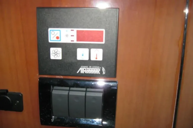 Slide: The Image of Interior of 2008 Doral Alegria yacht with polished wood paneling and blinds. - 58