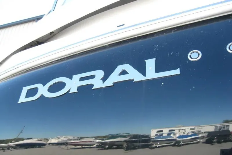 Slide: The Image of 2008 Doral Alegria boat on stands, rear view, with visible propellers and hull. - 6