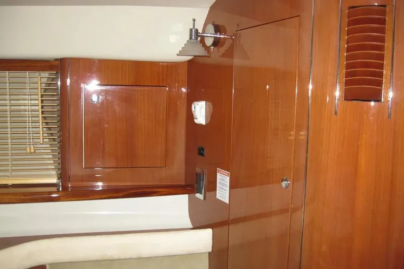 Slide: The Image of Control panel of a 2008 Doral Alegria boat with various switches and indicators. - 60