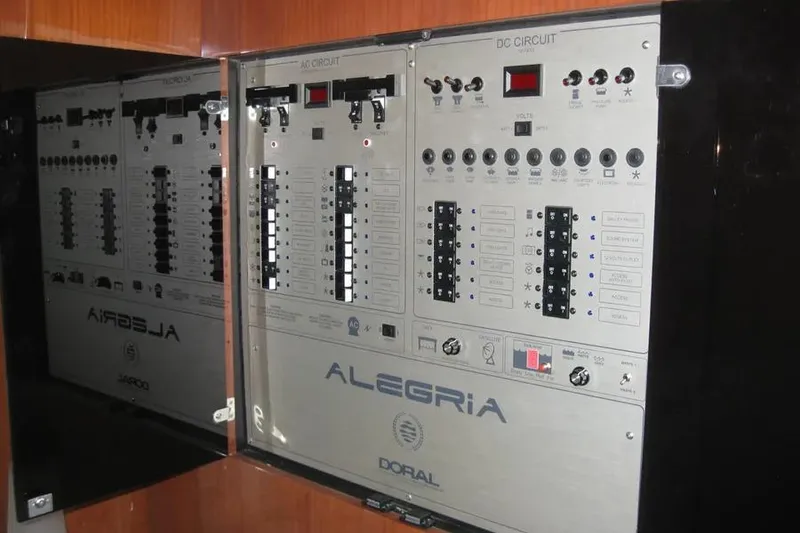 Slide: The Image of Electrical control panel on a 2008 Doral Alegria boat, featuring various switches and indicators. - 61