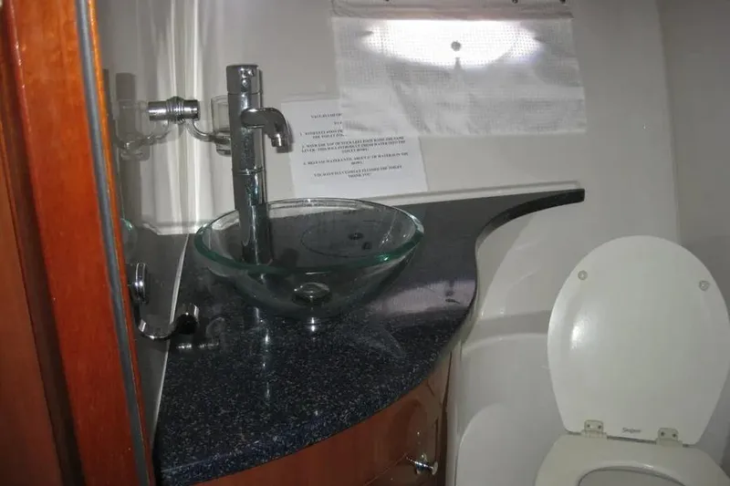 Slide: The Image of 2008 Doral Alegria boat shower with wooden seat and floor mat. - 69