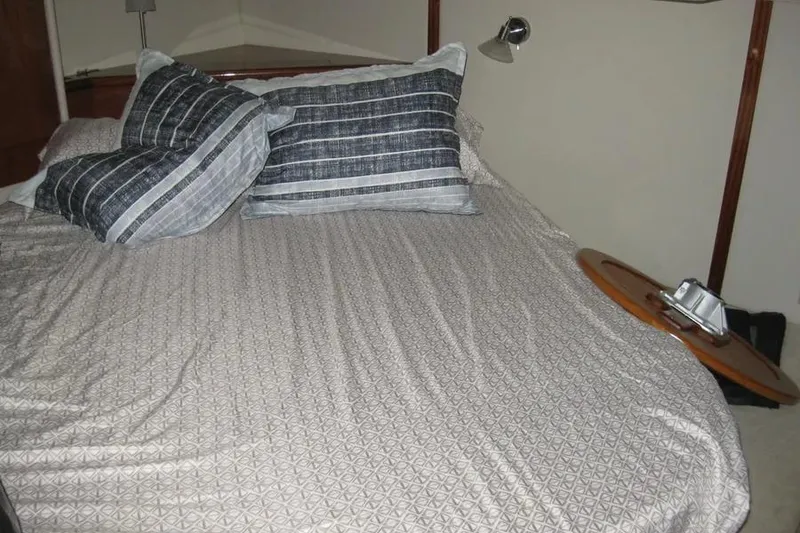 Slide: The Image of 2008 Doral Alegria yacht interior with wooden cabinets and oval window. - 73