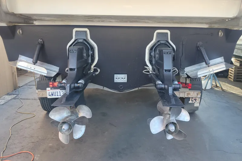 Slide: The Image of 2011 Bayliner 315 Cruiser boat stern with dual propellers and outboard motors. - 27