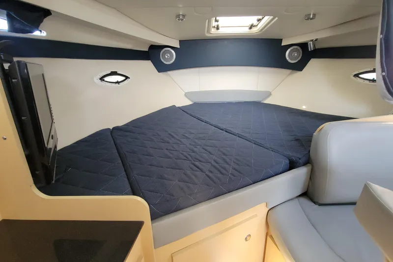 Slide: The Image of Interior cabin of 2011 Bayliner 315 Cruiser with cozy bed and modern design. - 32